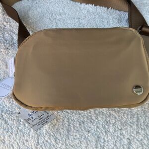 New tan design over the  crossbody purse